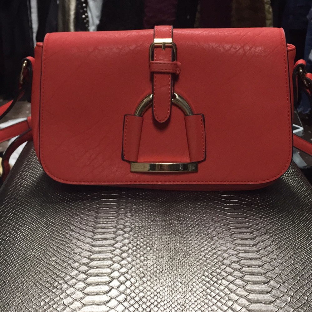 Coral, red brand new condition purse